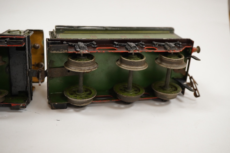 An 0 gauge Bing (or possibly Carette) for Bassett-Lowke tinplate clockwork GNR 4-4-2 tender locomotive, 1442, with original clockwork mechanism in yellow and black lined green livery